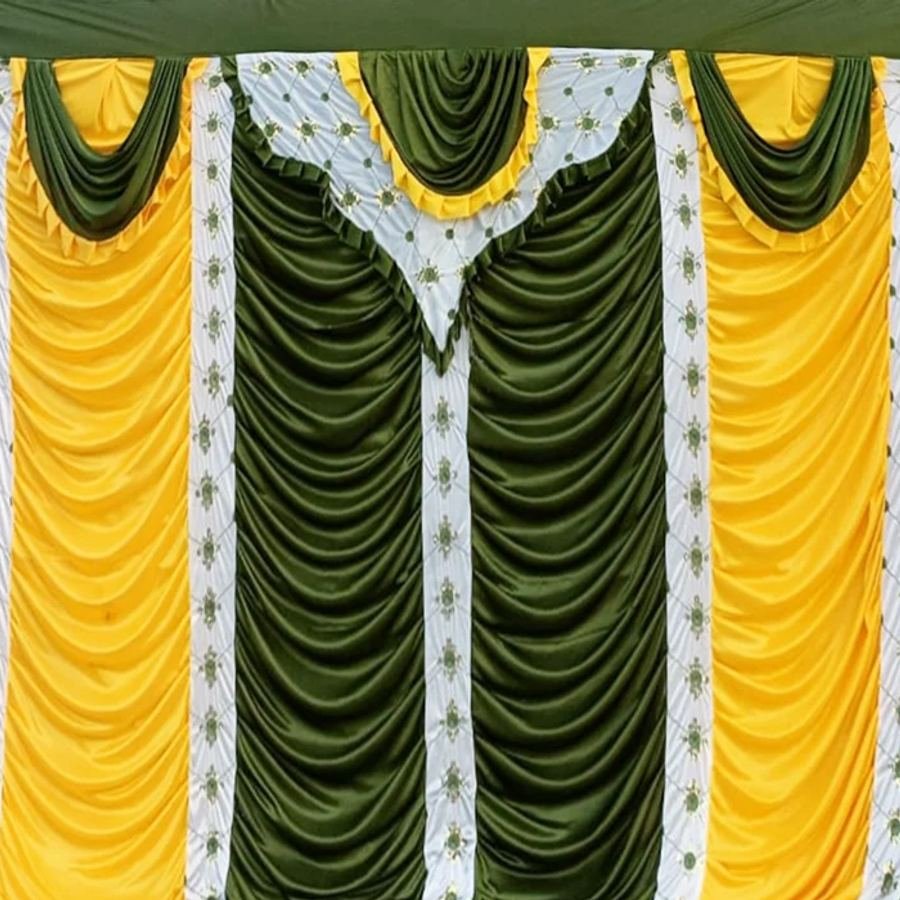 Green and gold draped stage backdrop
